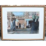 John Linfield RWS (1930-) figures in the market at Aswan, a pastel and chalk on paper, signed to