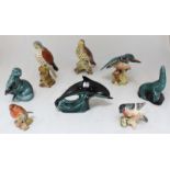 A group of eight ceramic animal figures, comprising five by Beswick and three by Poole, including
