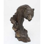 A hollow-cast patinated bronze figure group of a bear, 29cm high