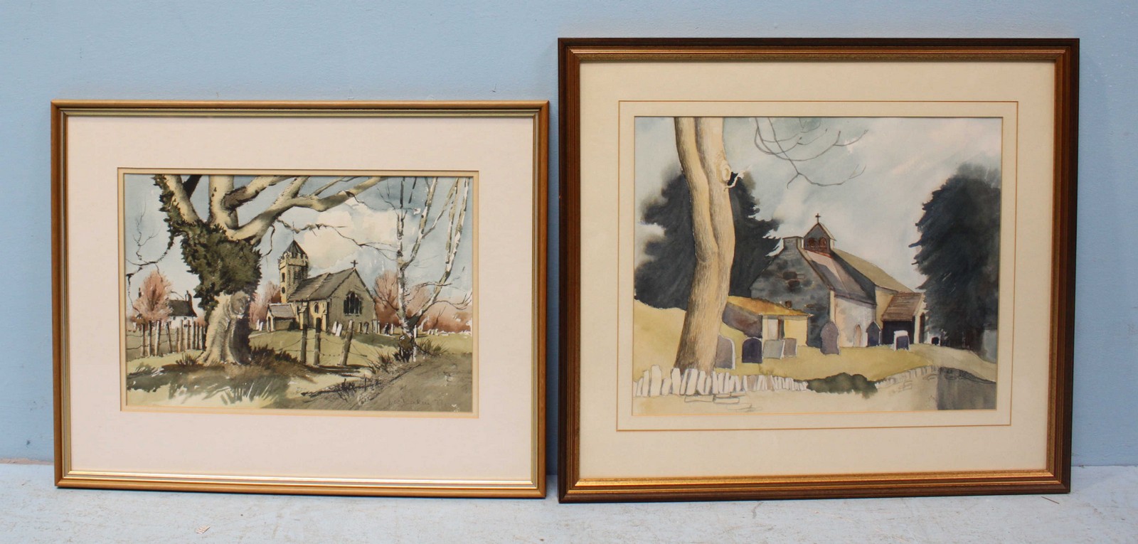 Two various watercolours depicting churches with graveyards, one indistinctly signed and dated '77'