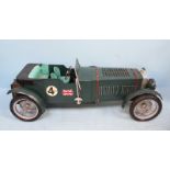 A 1920s Jaguar 'style' racing car, of metal construction finished British Racing Green, 130cm long