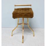 A Victorian brass revolving piano stool, with a green, fabric upholstered button studded seat,