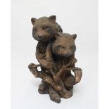 A hollow-cast patinated bronze figure group of a bear and cub, 26cm high