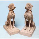 A pair of life-size carved hardwood garden figures of seated hounds , on plinth bases, 83cm high