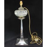 An Arts and Crafts silver oil lamp base by 'George Edward & Sons' converted to an electric lamp,