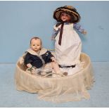 An early 20th century Porzellanfabrik Burrgrub doll, impressed mark '169,' with porcelain head,