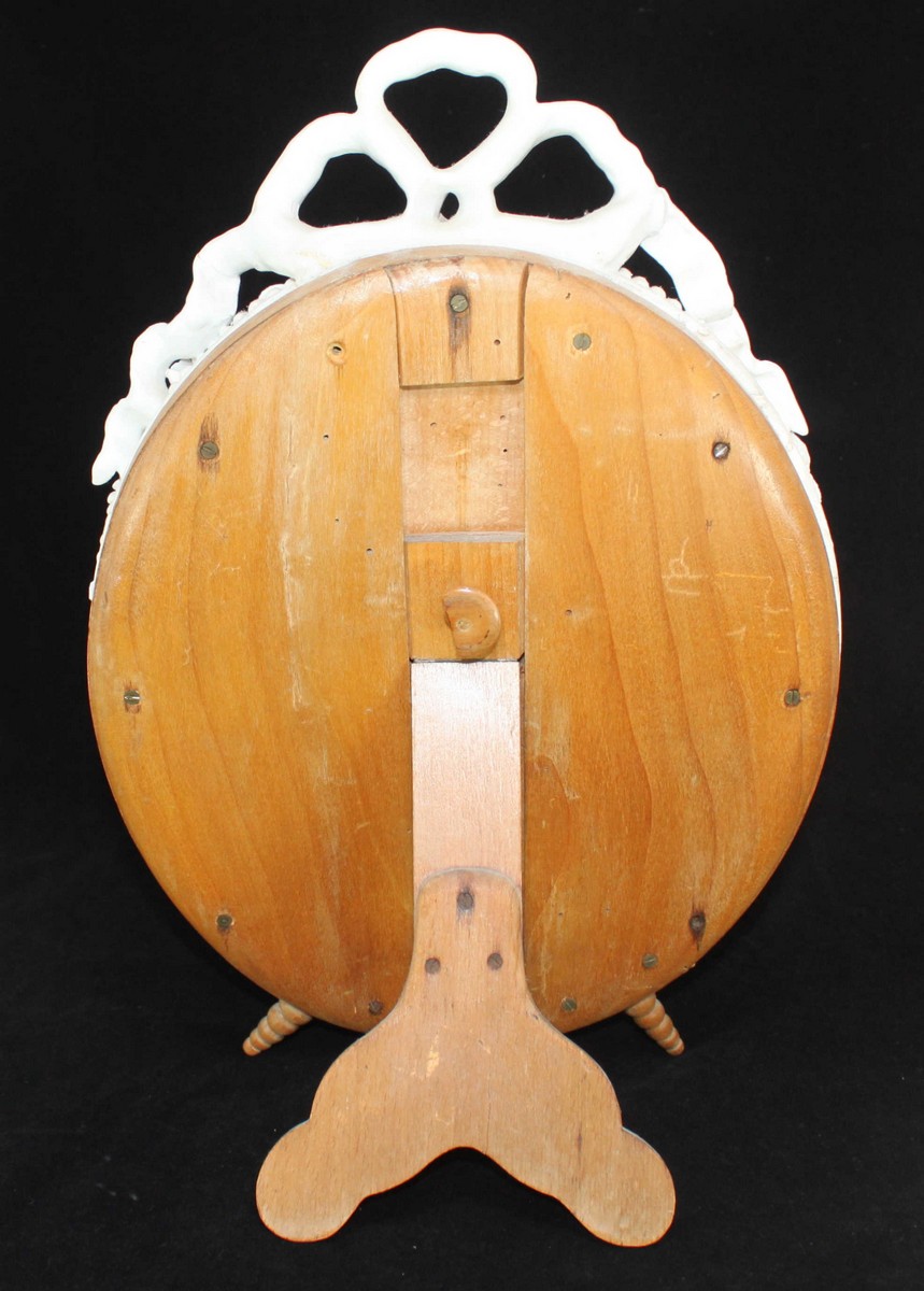 A Meissen Blanc-de-Chine porcelain oval easel mirror, modelled with tied-bow crest, bead and - Image 2 of 2