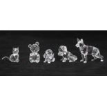 Five Swarovski crystal figures, comprising German Shepherd, St Bernard puppy, Beagle puppy, seated