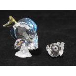 Two Swarovski crystal figures of fish, including a tropical blue tang fish and a small puffer
