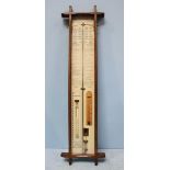 A reproduction oak cased Admiral Fitzroy mercury barometer of rectangular form, with thermometer