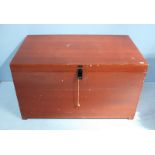 A large stained mahogany trunk, of rectangular form with hinged top with hasp and staple,