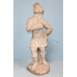 A 19th century carved stone figure of a 'Hawker' boy, in medieval dress, looking skyward and with