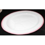 A large 19th century oval meat plate by 'Ashworth' with gravy well and decorated with a pink rim.