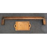 A Newlyn style copper fire fender with a moulded scrolled design and studded detailing and a
