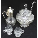 A large cut glass lidded punch bowl with matching ladle and two cups, together with a glass claret