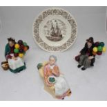 Three Royal Doulton figures, 'The Old Balloon Seller' HN1315, 'The Balloon Man,' HN1954, and 'Pretty