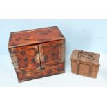 A Japanese parquetry cabinet, with two panelled doors opening to reveal six drawers, above a long