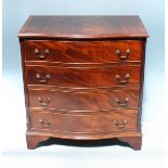 A reproduction serpentine front, mahogany chest of four long graduated drawers, raised on shaped