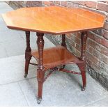 An Edwardian mahogany octagonal table, with under-tier, X stretcher and raised on shaped and