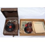 A 1920-30s portable gramophone in brown vinyl case, together with a large quantity of contemporary