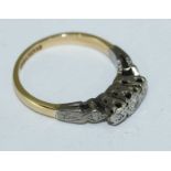 An 18ct gold and platinum three-stone illusion-set diamond ring, 2.84grms