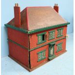 A 1920's wooden dolls house, the front panel opening to reveal a fitted interior. 66cm wide.