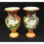 A pair of Doulton 'Impasto' ware baluster vases, shape 742, decorated with flowers and foliage to