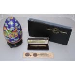 A Cloisonne egg on stand with box, together with a small quantity of FDC's boxed gold-plated