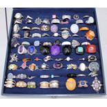 Seventy-seven modern silver rings, including Suarti and QVC etc, variously set with gemstones,