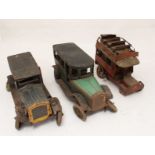 A collection lithographed clockwork toy cars including a KBN 8-seater car, OROBR car, and a