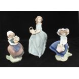 Three various Lladro porcelain figures of girls with flowers. (6130) (5222) (5223) Tallest figure