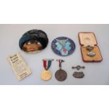 A 1920s French novelty Cloche Cap pin cushion 'La Pepetichie,' together with a Royal Airforce