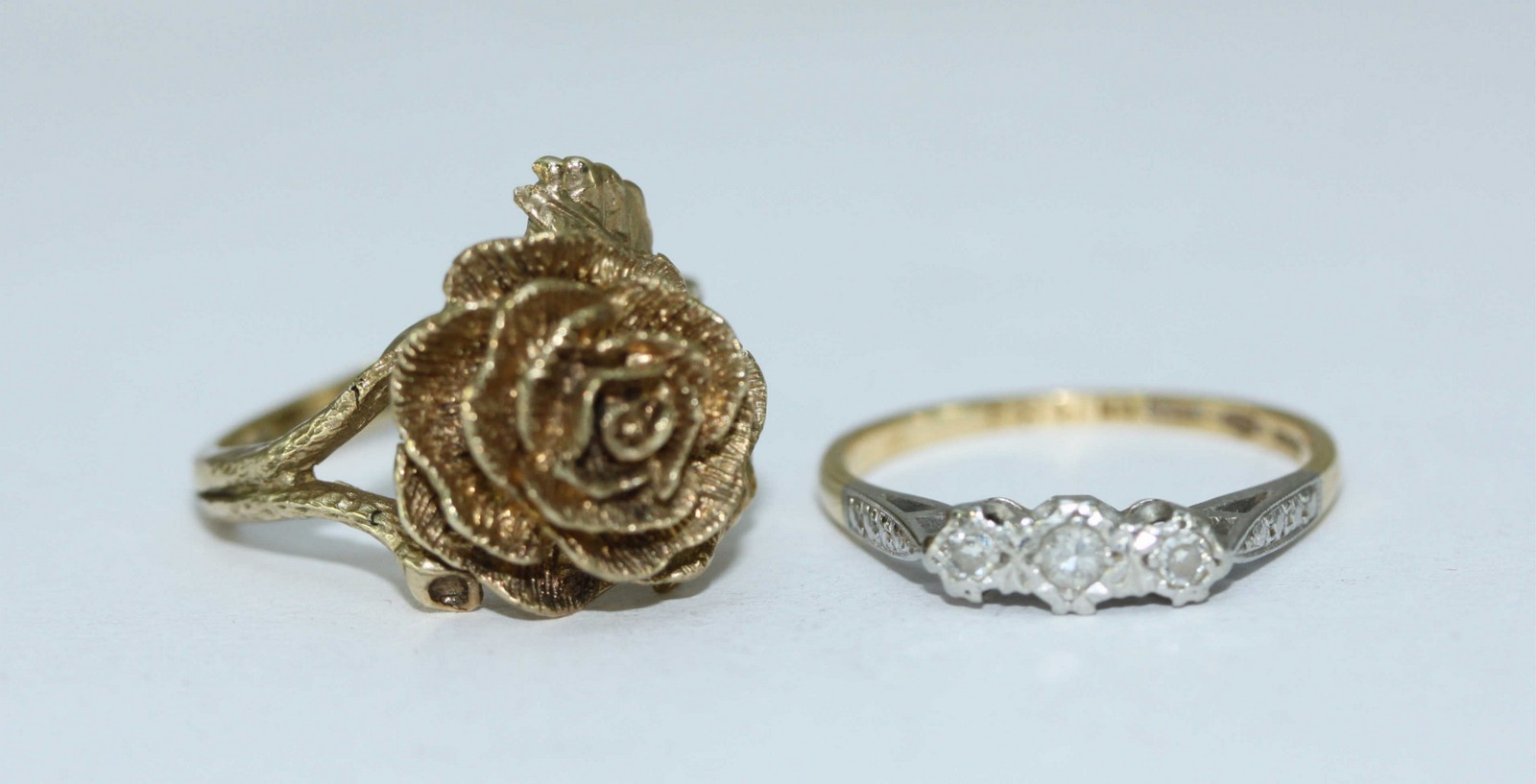 A 9ct gold ring modelled as a rose with leaves and stem forming the shank, 5.25grams, together