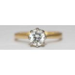 An 18ct Yellow Gold and Solitaire Diamond Ring, claw-set a round brilliant cut diamond weighing