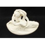 A Parian figure-group modelled as a couple in an embrace, 36cm wide.