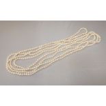 A long string of cultured pearls. Pearls measure approximately 6 x 5.5mm each.