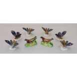 A set of six porcelain menu holders modelled as butterflies, decorated with a blue and gilt