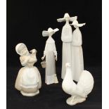 A Lladro porcelain figure-group depicting two nuns and a single Lladro figure of a nun, together