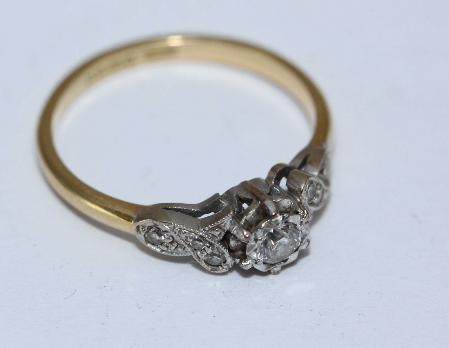 An 18ct gold and diamond ring, centrally set with a rbc diamond, measuring approximately 0.20cts, - Image 2 of 2