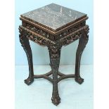 A late 19th century Chinese stained rosewood jardinière stand with inset marble top and later