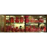 A good collection of thirty-four pieces of Victorian cranberry glass, including a pair of decanters,