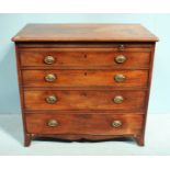 A 19th Century mahogany chest of four long graduated drawers with brushing slide and shaped apron.