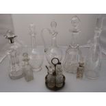 A silver mounted glass cluck cluck decanter, together with four other glass decanters and a small