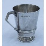 A silver christening mug, baring makers mark 'Barker Brothers.' Date marked Birmingham 1937. Gross