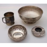 A silver mug, gross weight approximately 5.2oz, together with three various white metal bowls etc.