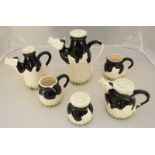 A six-piece Paul Cardew design, novelty 'Cow' tea set, comprising of teapots and jugs etc.