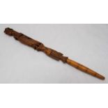 A late 19th / early 20th century carved fruitwood parasol handle or fly whisk handle, finely