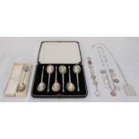 A cased set of six silver teaspoons and a souvenir spoon, together some silver coin jewellery and