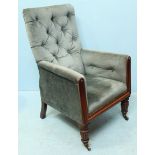 A William IV mahogany armchair, with button back, green fabric upholstery, and raised on turned
