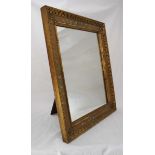 A gilt framed easel mirror of rectangular form, with hand-painted floral decoration. 56 x 46cm.